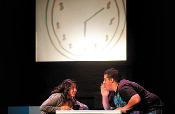 Pauly Denetclaw, left, and Luis Rodriguez talk about life over a cup of coffee in a trial-and-error search for love in "Sure Thing," a skit within David Ives' "All in the Timing" performed by Gallup Bengal Drama performers at Gallup High School on Thursday. © 2011 Gallup Independent / Adron Gardner 